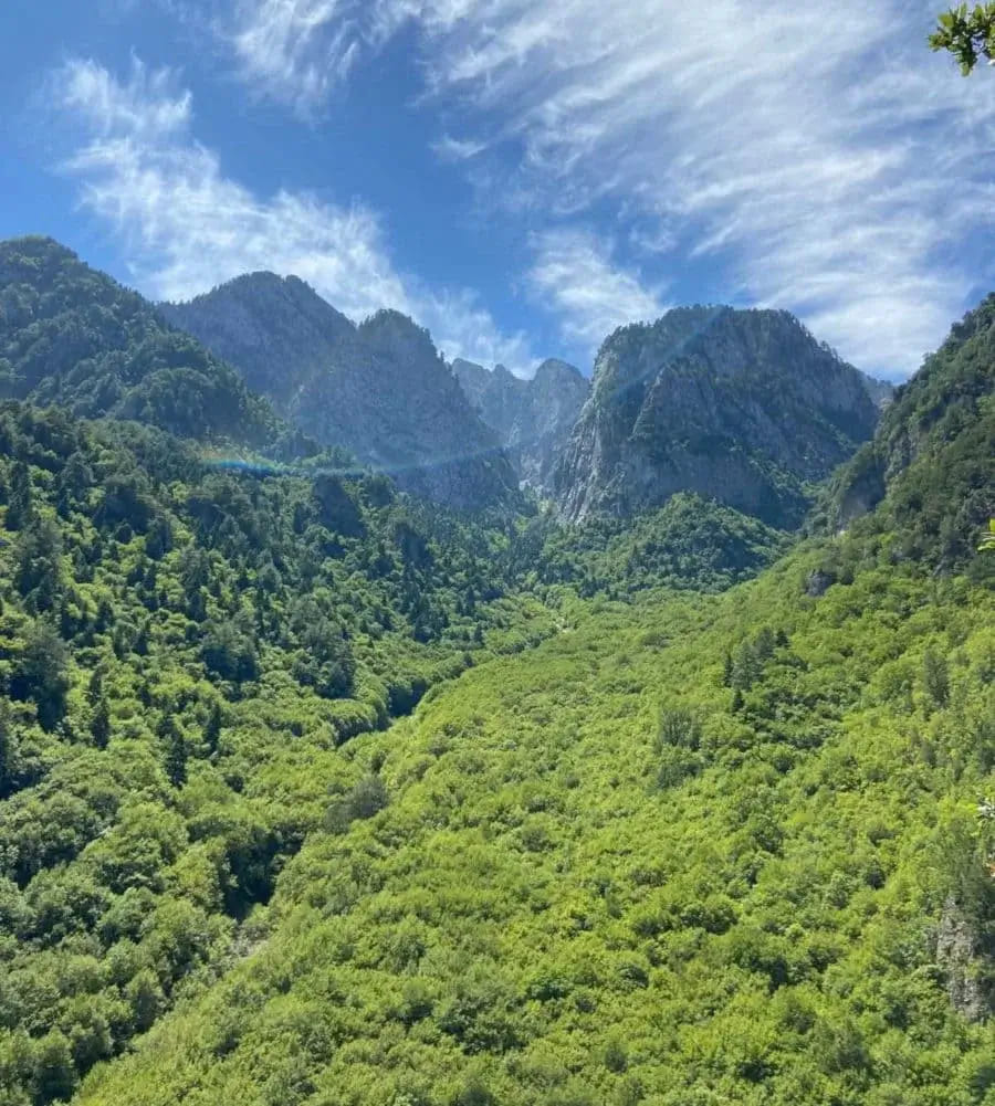 Hiking beneath the limestone peaks of the Pindus mountains in Greece