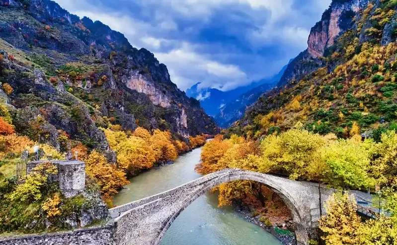 Historic stone bridge spanning a river in Epirus