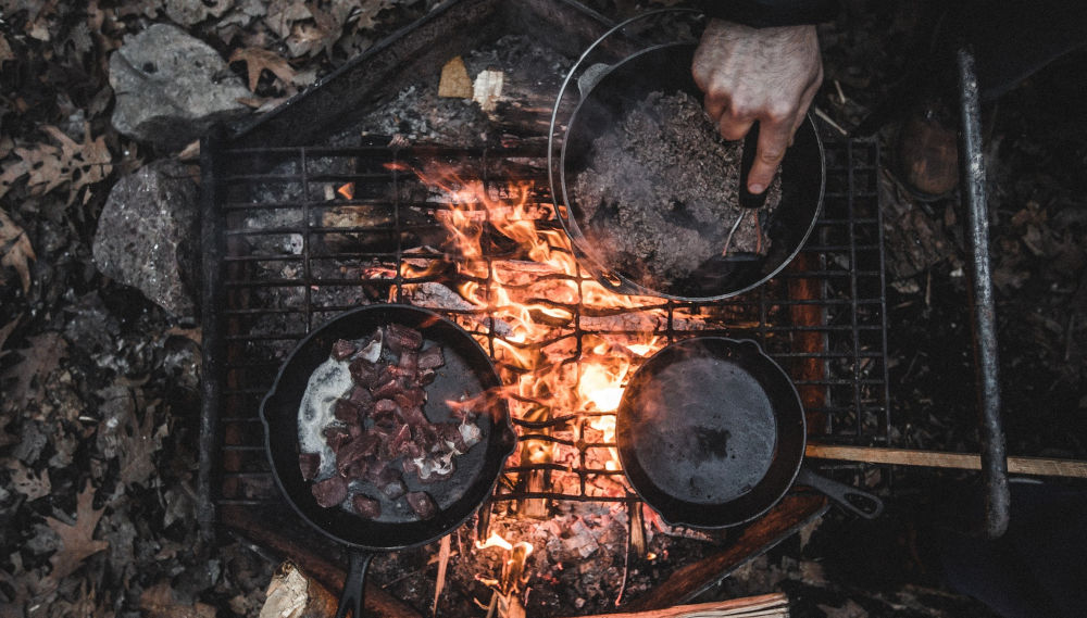 A shared outdoor cooking setup at camp